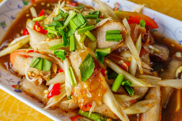 Closeup Thai food papaya salad with grilled pork neck on whitebackground isolation clippingpath.Isan Thai food is popular in Asia.