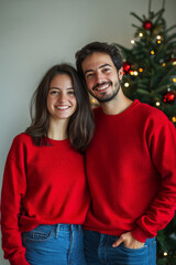 Fototapeta premium Red Christmas Vibes: Smiling Couple in Cotton Sweatshirts