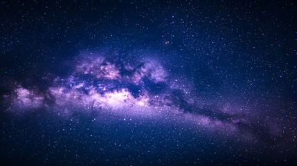 Obraz premium Vast night sky filled with stars and a stunning galaxy formation.