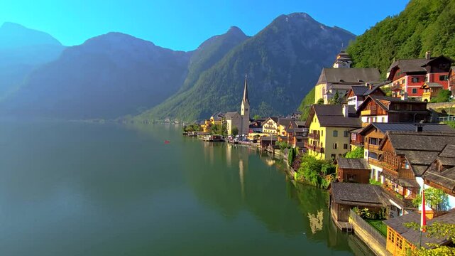 Breathtaking panorama of Hallstatt, Austria, showcasing colorful houses by the serene lake with towering mountains.