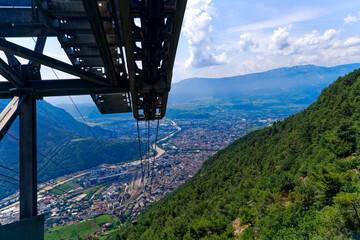 Aerial view from cable car way up of Italian City of Bolzano with scenic landscape on a sunny summer day. Photo taken July 17th, 2024, Bozen Bolzano, Italy.