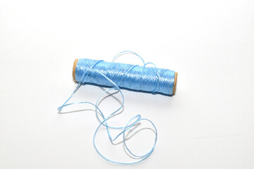 Spools of colours threads isolated on white background. High quality photo