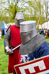 Knight fight, show fight of disguised knights and warriors, medieval soldiers with swords and...