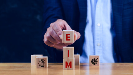 EIM Enterprise information management system on wooden cubes, EIM Global Network with Analyzing Technological Data, Efficient Information Management.