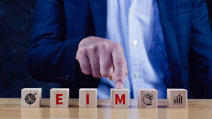 EIM Enterprise information management system on wooden cubes, EIM Global Network with Analyzing Technological Data, Efficient Information Management.
