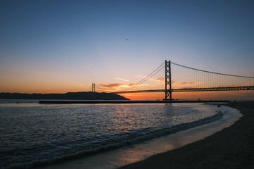 [HYOGO]Sunset view of Akashi Kaikyo Bridge, known as one of the world's largest suspension bridges, The orange sunset sky is beautiful, Azur Maiko, Japan