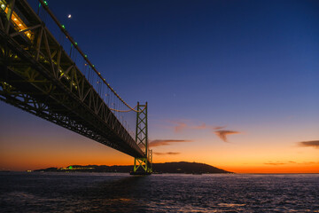 [HYOGO]Sunset view of Akashi Kaikyo Bridge, known as one of the world's largest suspension bridges, The view directly below the bridge with a beautiful contrast of the evening sky, Azur Maiko, Japan