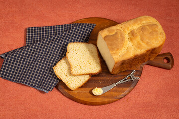 Fresh Baked Homemade Bread with Blue Cloth on Orange Background