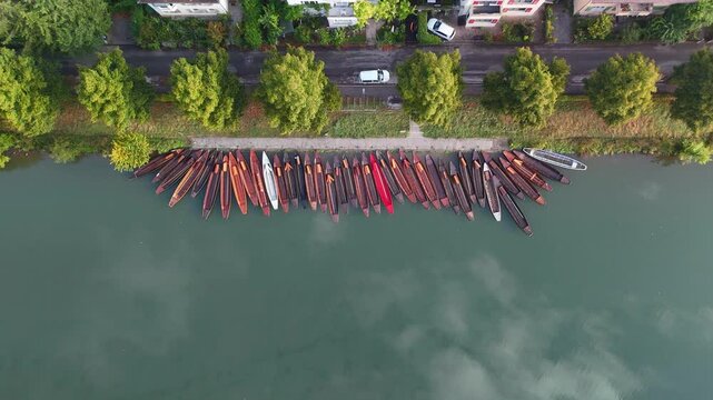 Aerial footage of ascent over traditional punt boats (Stocherkahn) on the Neckar River in T&uuml;bingen