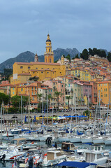 view of the port in menton, france with old town in background