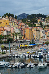 view of the port of menton with old town in the background