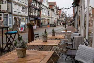 deserted street of a small old german town and street cafe. Celle. germany