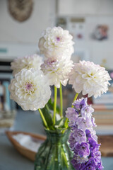 Bouquet with beautiful white dahlias in a vase indoors