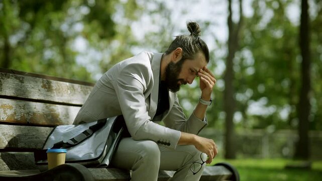 Contemplative man reflecting on life . Bad day . Hardships of life
