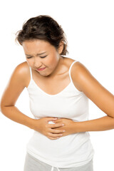 Young asian woman with stomach pain.