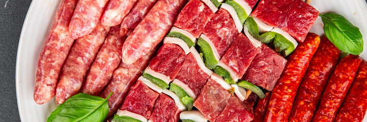 raw sausage meat assorted juicy pork, beef fresh delicious gourmet food background on the table rustick food top view copy space