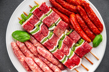 raw sausage meat assorted juicy pork, beef fresh delicious gourmet food background on the table...