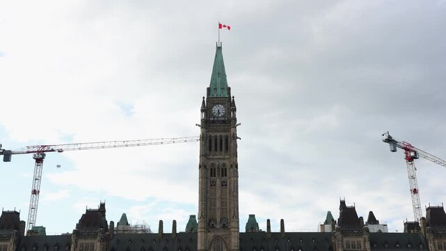 Canadian Parliament building a under restoration with flag in Ottawa, Canada
