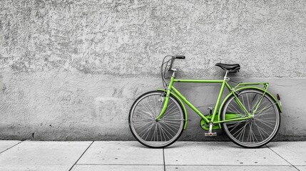 Vibrant Green Bicycle Pop Against Gray Sidewalk Monochrome Background