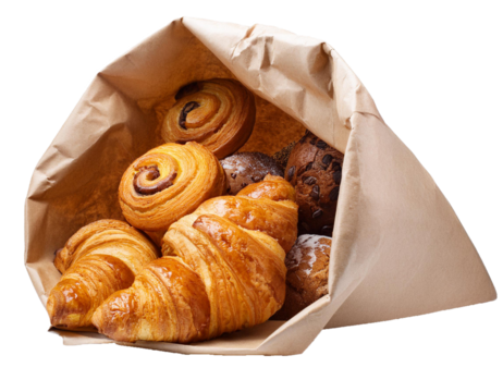 paper bag full of French pastry desserts isolated