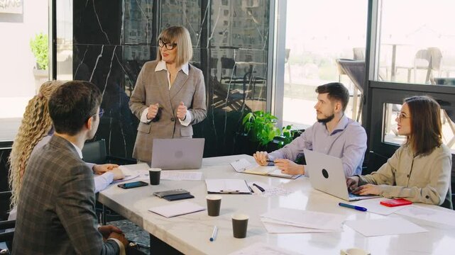 The business meeting was engaging and dynamic, fostering active collaboration among team members to significantly enhance teamwork and productivity