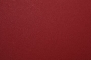 Red textured sheet background. Blank space for text