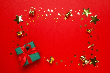 Beautiful gift box with confetti on a colored background