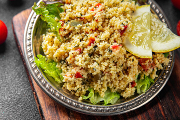 tabbouleh vegetable bulgur couscous dish fresh delicious vegetarian and vegan food gourmet food background on the table rustic food top view copy space