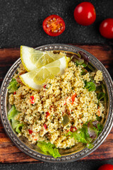 tabbouleh vegetable bulgur couscous dish fresh delicious vegetarian and vegan food gourmet food background on the table rustic food top view copy space