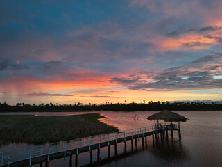 Obraz premium Captivating Aerial View of a Beautiful Cabana at Sunset, Sri Lanka – An Idyllic Coastal Getaway