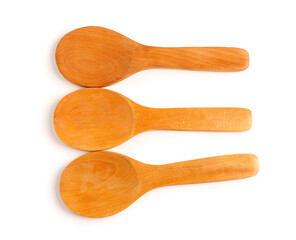 Empty wooden spoons isolated on white background