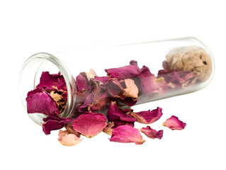 a glass bottle with a cork and a cork lid filled with dried flowers

