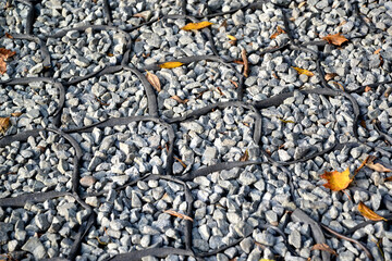 Geogrid filled with crushed stone. Garden path covering