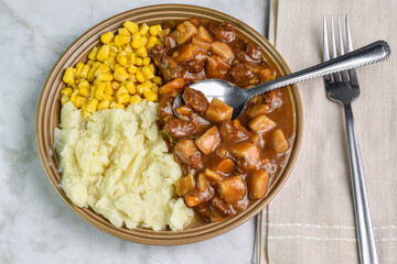 beef stew with  corn and buttered mash potatoes