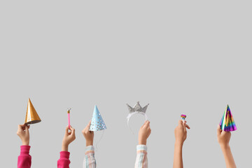 Children with party decor on light background