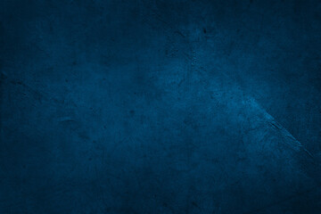 Blue textured concrete wall dark background