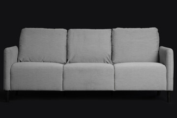 Grey sofa on black background