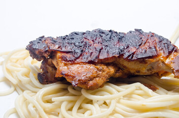 Fried chicken leg with noodles.