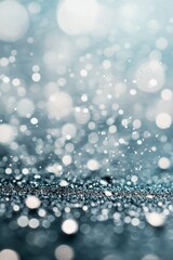 Gentle water droplets splash creating ripples on a serene blue surface during daytime