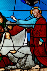 Stained glass of Jesus-Christ healing a Paralytic. Miracles of the Bible.
