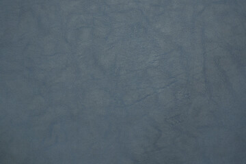 blue artificial leather with waves and folds on PVC base