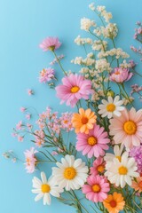 Colorful floral arrangement featuring daisies and wildflowers on a blue background