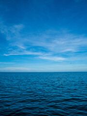 Obraz premium Landscape beautiful summer season vertical horizon look view tropical shore open sea cloud clean blue sky background calm nature ocean wave water nobody travel at Koh Muk Trang Thailand sun day time