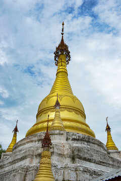 Golden Stupas against Blue Sky in Inle