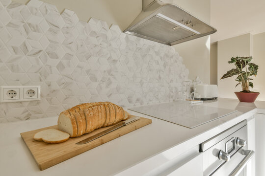 Modern kitchen interior with sliced bread on countertop