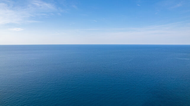 Aerial View of Calm Blue Ocean and Clear Sky Horizon