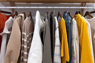 Assorted clothes hanging in a retail store display