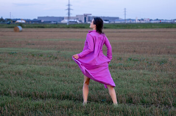 Young Woman's Dance of Freedom in Windy Fields: The Harmony of Femininity and Freedom