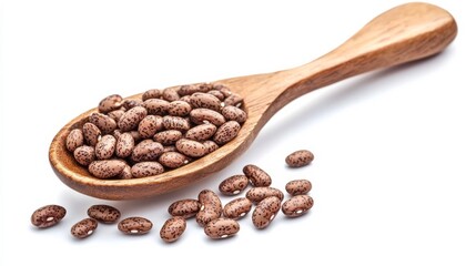 Obraz premium Whole pinto beans with a brown spoon