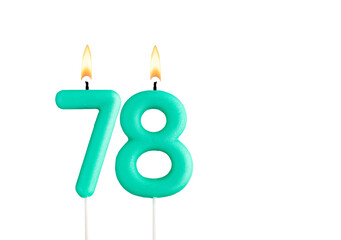 Green birthday candle on white background - Candle number 78